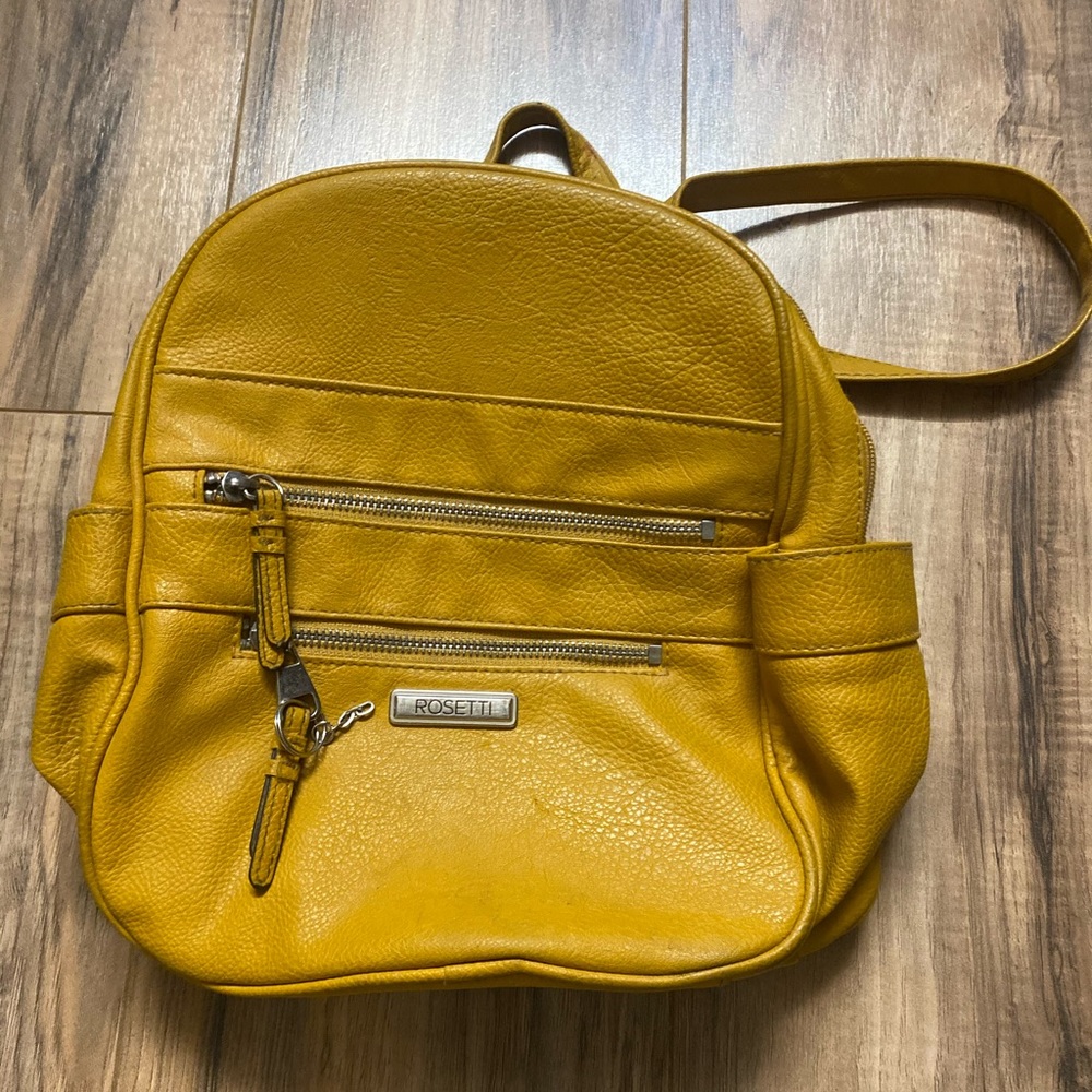 Mini gold yellow backpack from Rosetti.